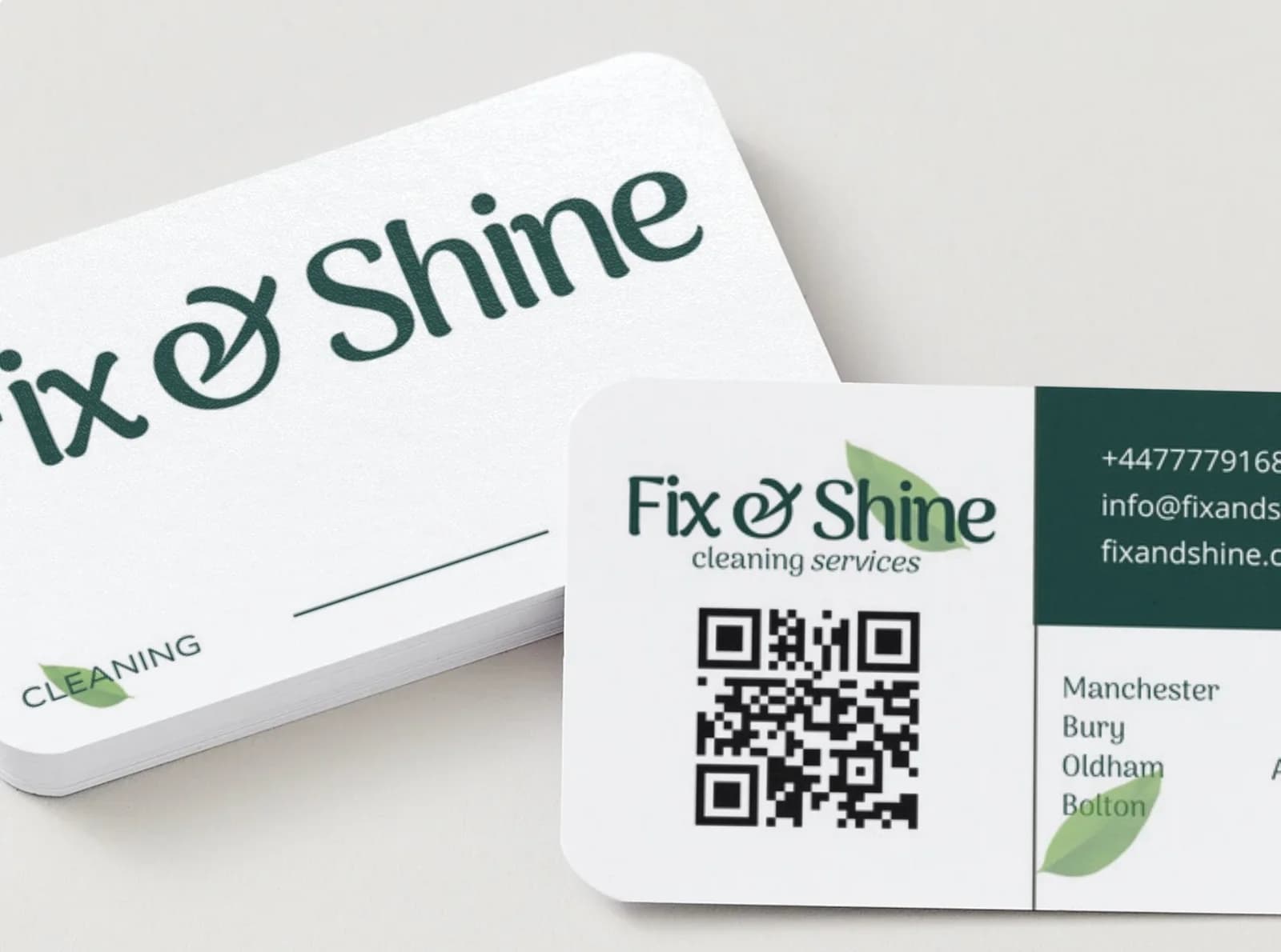 Close detail of Fix & Shine business card design.